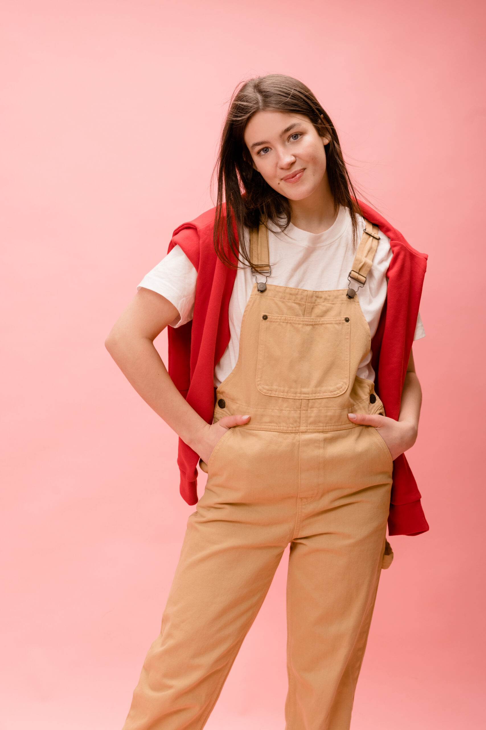 stylish caucasian young brunette woman posing photo shoot studio pink background leisure lifestyle beauty concept